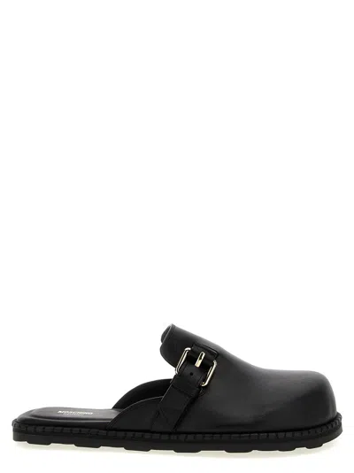 Moschino 'birky' Sabots In Black