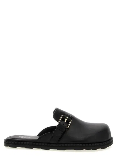 Moschino 'birky' Sabots In Black