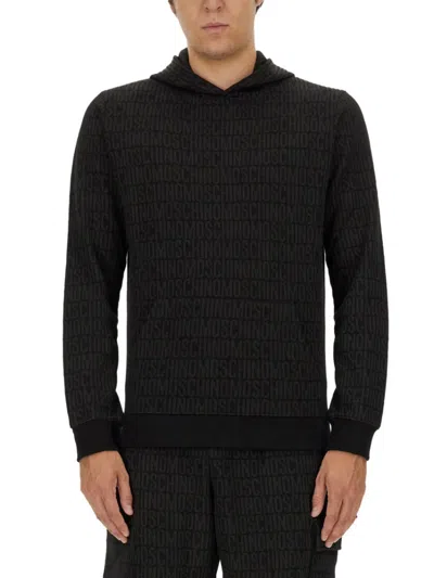 Moschino Couture Sweatshirt With All Over Logo In Pattern