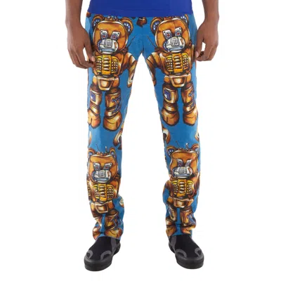 MOSCHINO BLUE ALLOVER ROBOT PRINT COTTON TROUSERS, BRAND SIZE 44 (WAIST SIZE 29")