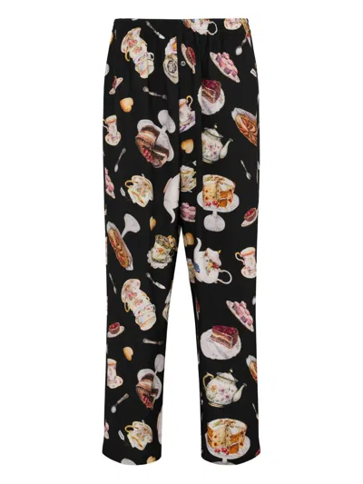 Moschino Dessert-print Trousers In Black