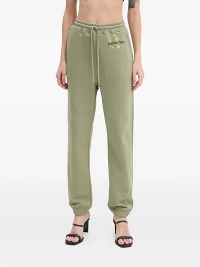 Moschino Drawstring Printed Trousers In Green
