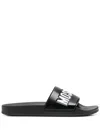 Moschino Embossed-logo Slides In Black