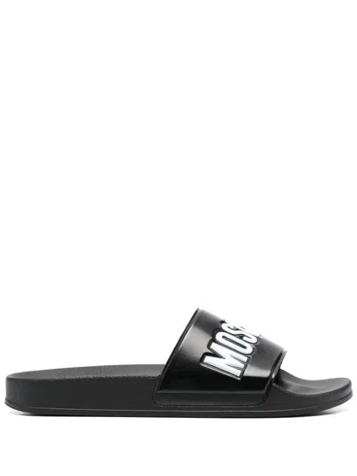 Moschino Embossed-logo Slides In Black