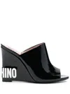 Moschino Embossed-logo Wedge Mules In Black