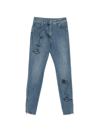 Moschino Face-embroidery Zip-cuff Jeans In Blue