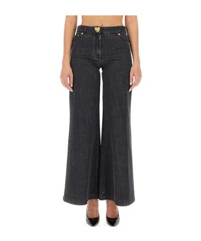 Moschino Flared-design Jeans In Black