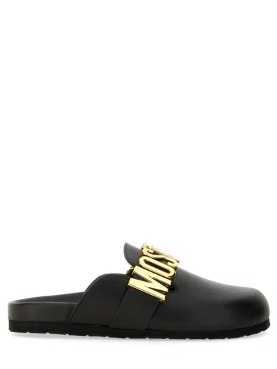 Moschino Flat Leather Sandals With Bold Logo Detail In Black