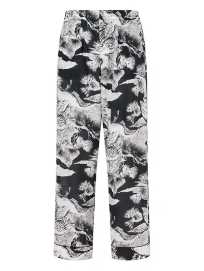 Moschino Floral-print Trousers In Black