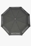 Moschino Folding Umbrella With Logo In Grey