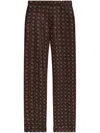 Moschino Geometric-print Trousers In Brown