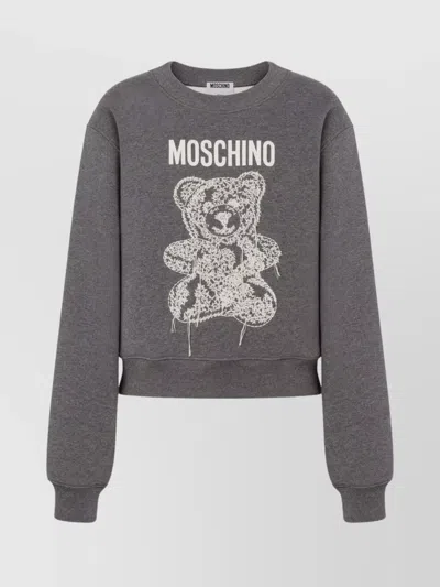 MOSCHINO GRAPHIC PRINT LONG SLEEVE CREW NECK KNITWEAR