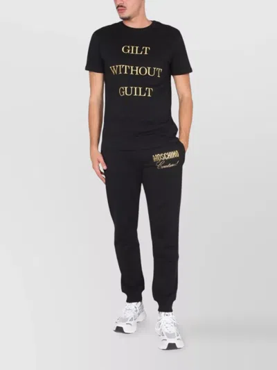MOSCHINO "GUILT WITHOUT GUILT" T-SHIRT