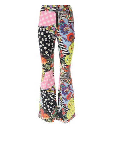 Moschino Jeans Front Zipped Patchwork Printed Trousers In Multi