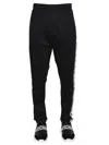 Moschino Jogging Pants With Adjustable Drawstring And Zippered Pockets In Black