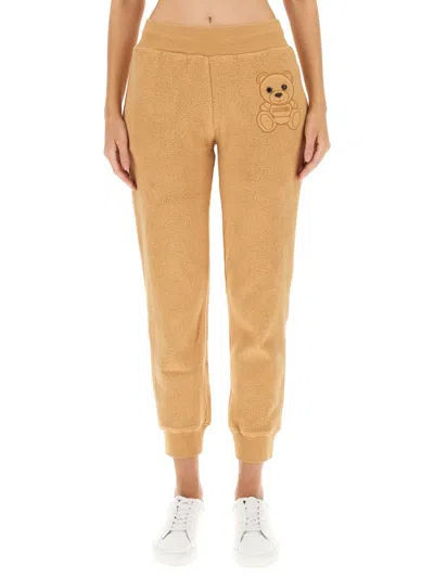 Moschino Teddy-bear Detail Cropped Trousers In Beige