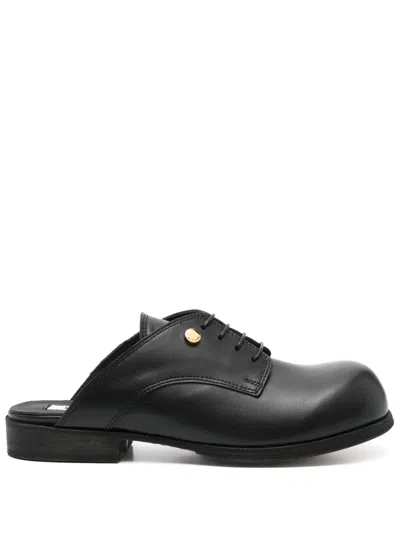 Moschino Leather Mules In Black