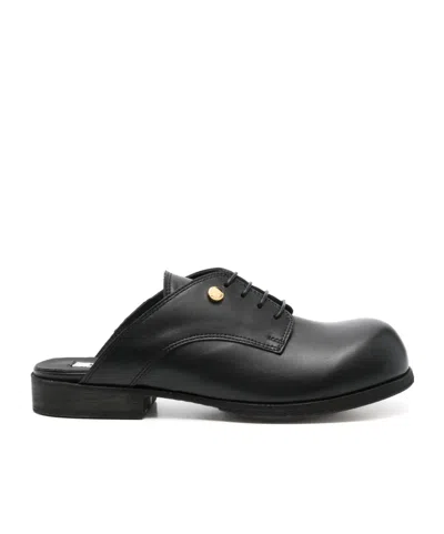 Moschino Leather Mules In Black