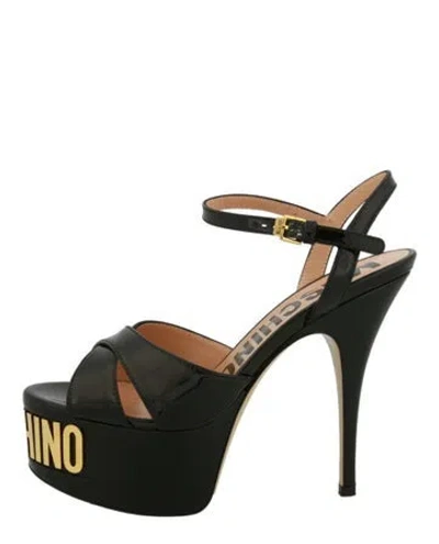 Pre-owned Moschino Lettering Leather Pumps W/ Tags In Black