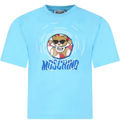 MOSCHINO LIGHT BLUE T-SHIRT FOR BOY WITH MULTICOLORED PRINT AND TEDDY BEAR