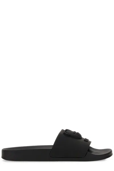 Moschino Logo Embossed Slip In Black
