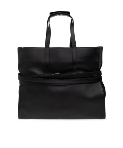 Moschino Logo Embossed Tote Bag In Black