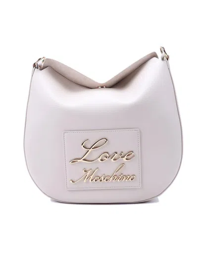 Moschino Logo-lettering Magnetic Fastened Shoulder Bag In Avorio