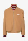 Moschino Logo-patch Twill Bomber Jacket In Brown