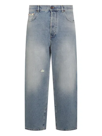 Moschino Logo-plaque Distressed Jeans In Blue