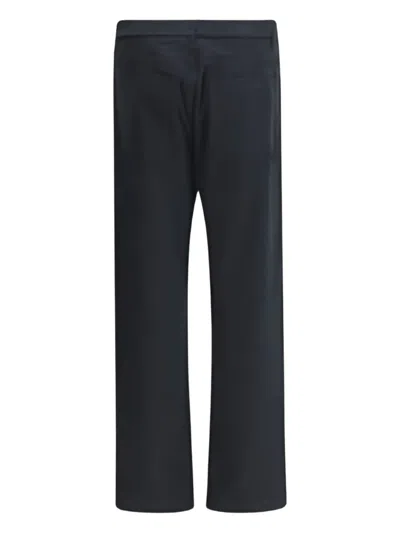 Moschino Logo-plaque Trousers In Black
