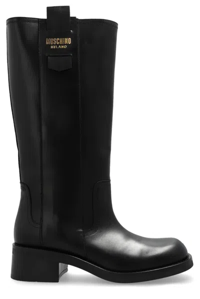 Moschino Logo Appliqué Leather Boots In Black