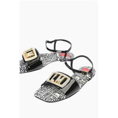 Moschino Love Patent Leather Flat Sandals With Logoed Jewel Detail In Black