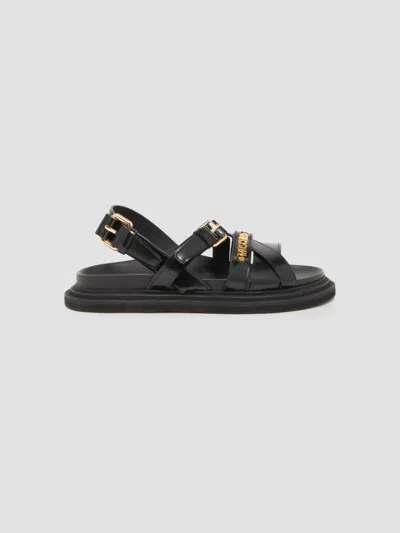 Moschino Logo Leather Sandals In Animal Print