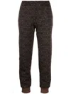 Moschino All-over Jacquard Logo Pants In Brown