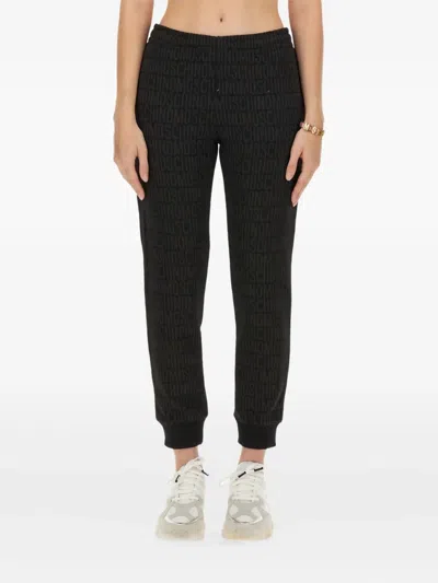 MOSCHINO MONOGRAM-PRINT TRACK PANTS