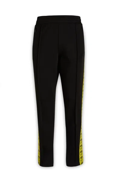 Moschino Logo Printed Side Striped Jogging Pants In Black