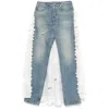 Moschino Ruffled Overlay Distressed Jeans In Blue