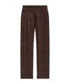 Moschino Geometric-print Trousers In Black