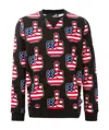 Moschino Printed Long-sleeved Sweater In Black
