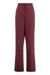Moschino Couture Printed Silk Pants In Red