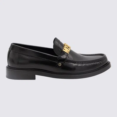 Moschino Logo-lettering Slip-on Loafers In Black