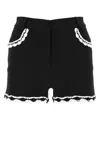 Moschino High-waist Lace-trim Buttoned Shorts In Black