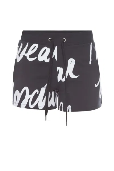 Moschino Shorts Tuta Neri Con Scritta All Over In Nero