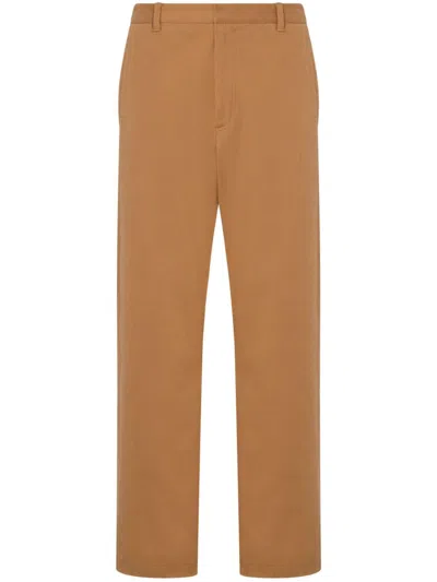 Moschino Slogan-print Cotton-blend Trousers In Beige