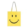 MOSCHINO MOSCHINO SMILE PATTERNED TOP HANDLE BAG