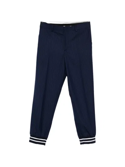 Moschino Striped-cuff Trousers In Blue