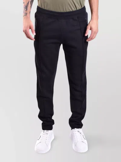 MOSCHINO TROUSERS WITH ELASTIC WAISTBAND AND RIBBED CUFFS