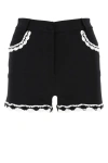 Moschino High-waist Lace-trim Buttoned Shorts In Black