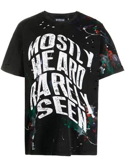 Mostly Heard Rarely Seen Warped-text Paint T-shirt In Black