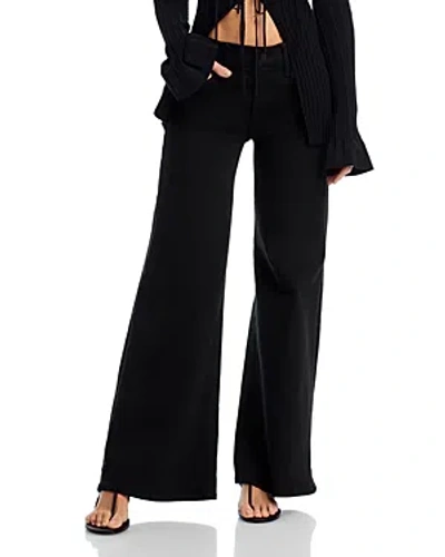 MOTHER PETITES THE LIL TWISTER SNEAK JEANS IN PITCH